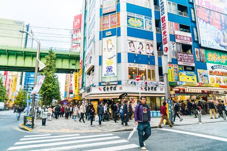 TOKYO, JAPAN - November 26, 2015: Crowded people traffic passes with colorful signs at Akihabara. The electronics and Toys district in Tokyo Japan.のeditorial素材