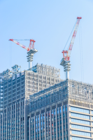 Crane construction building with blue sky backgroundの写真素材