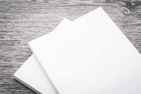 Blank white mock up book on wooden background - filter effect processing