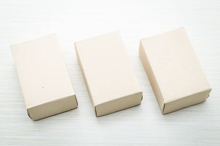 Brown box mock up on wooden background - filter effectの写真素材