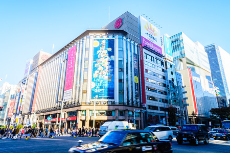 TOKYO - November 28, 2015: The Ginza District November 28, 2015 in Tokyo, Japan. Ginza extends for 2.4 km and is one of the world's best known shopping road districts.のeditorial素材