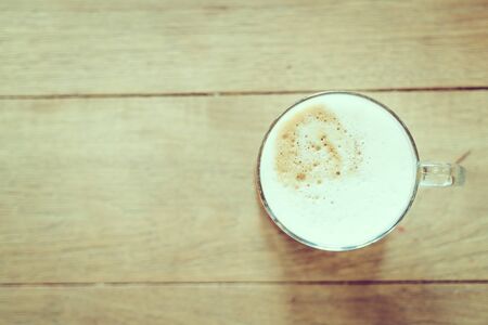 Coffee cup in coffee shop cafe - vintage filter