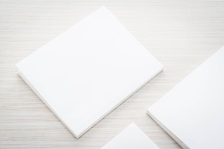 Blank white mock up book on wooden background - filter effect processing