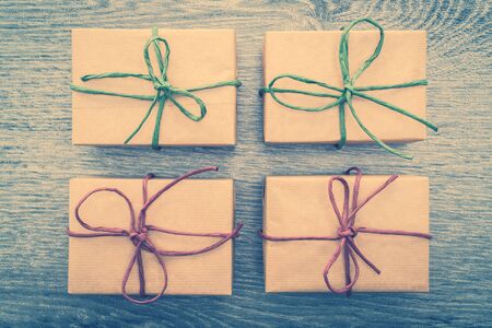 Vintage Brown gift box on wooden background - vintage filter processing