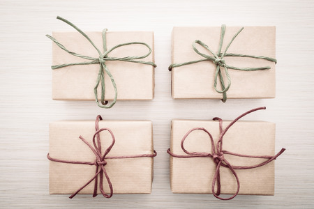 Vintage Brown gift box on wooden background - vintage filter processingの写真素材
