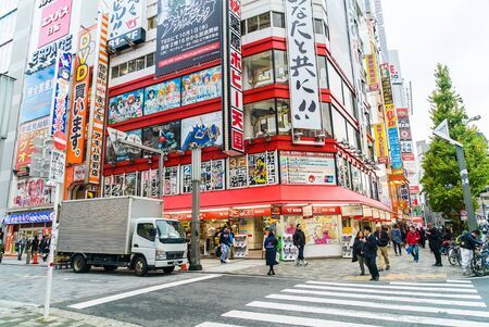 TOKYO, JAPAN - November 26, 2015: Crowded people traffic passes with colorful signs at Akihabara. The electronics and Toys district in Tokyo Japan.のeditorial素材