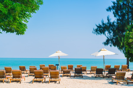 Umbrella pool and chair in luxury hotel pool resort on the beach - Filter Processing styleのeditorial素材