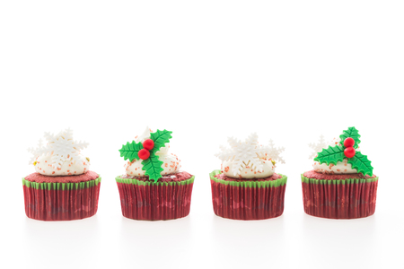 Christmas cupcakes isolated on white backgroundの写真素材