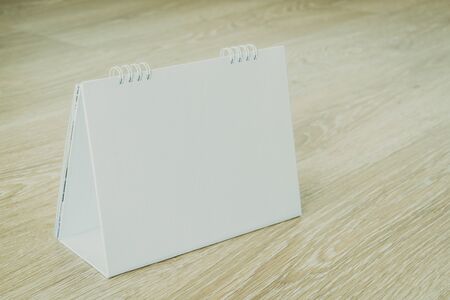 Blank calendar on wooden background - Vintage filterの写真素材