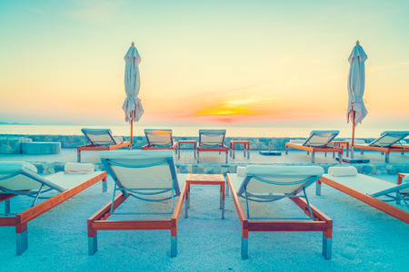 Beautiful luxury hotel swimming pool resort with umbrella and chair - Vintage filterの写真素材