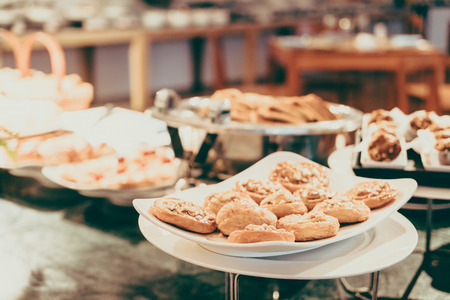 Selective focus point on Catering buffet in hotel restaurant - Vintage filter effectの写真素材