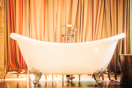 Beautiful luxury vintage bathtub decoration in bathroom interior - Vintage filterの写真素材