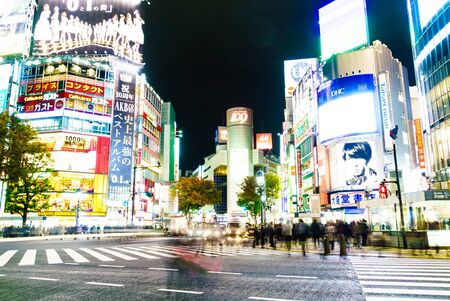 TOKYO, JAPAN - November 25, 2015: Crowded peoples walk at Shibuya Crossing during the holiday...