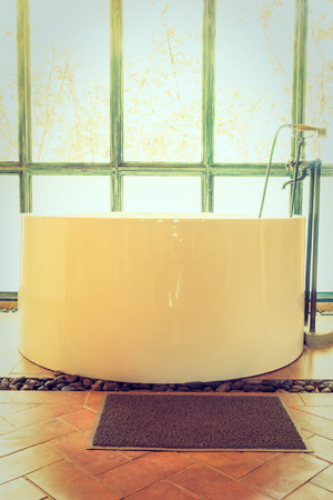 Vintage bathtub decoration in bathroom interior - Vintage Filterの写真素材