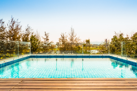 Empty beautiful and luxury swimming pool in hotel pool resort - Vintage and Boost up color...