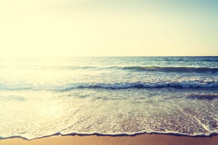 Beautiful Sunset with sea and beach - Vintage and sunflare filter effect