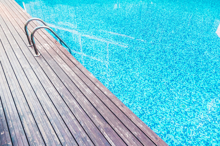 Beautiful luxury swimming pool at hotel resort with stair pool - Vintage Filter