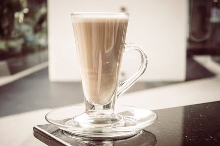Selective focus point on Latte coffee glass - Vintage Filter