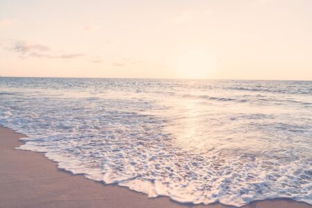 Beautiful Sunset with sea and beach - Vintage and sunflare filter effectの写真素材