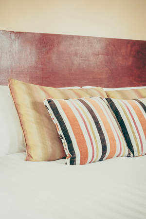 Selective focus point on Pillow and bed decoration interior of bedroom with morocco style - Vintage Filterの写真素材
