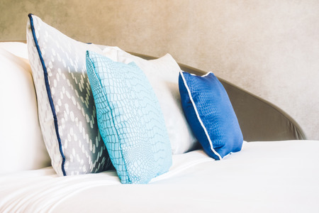 Beautiful luxury pillow on bed decoration in bedroom interior - Light Vintage Filterの写真素材