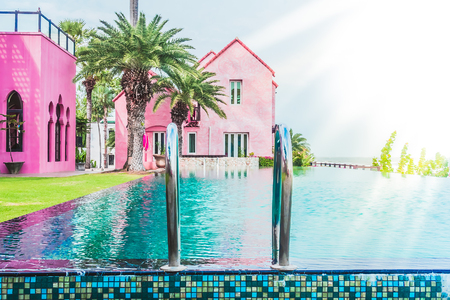 Beautiful luxury Swimming pool resort hotel with stairs pool - Vintage Filter and sunflare effect processingのeditorial素材