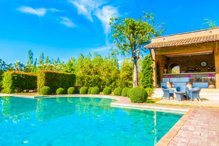 Outdoor swimming pool with beautiful landscape background