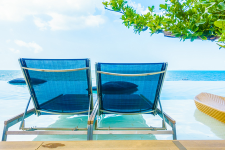 Beautiful luxury hotel swimming pool resort with beach and sea - Boost up color Processingのeditorial素材