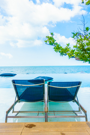 Beautiful luxury hotel swimming pool resort with beach and sea - Boost up color Processingのeditorial素材