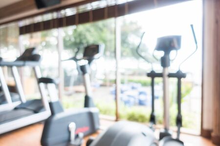 Abstract blur fitness equipment and gym room interior for backgroundの写真素材
