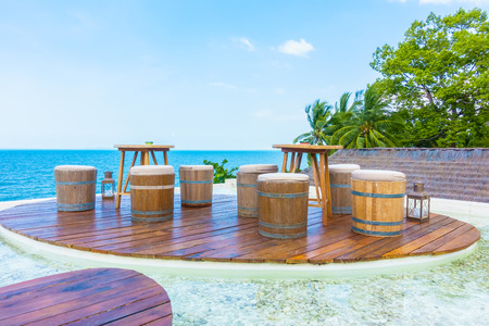 Empty Table and chair on the beach and sea backgroundの写真素材