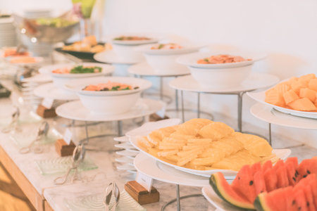 Selective focus point on Catering buffet in hotel restaurant - Vintage filter effectの写真素材