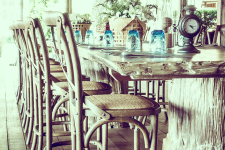 Empty table and chair decoration in restaurant - Vintage light Filter