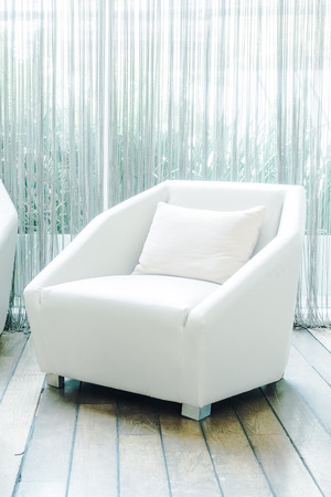 Beautiful luxury pillow on sofa decoration in living room interior - Vintage Light Filterの写真素材