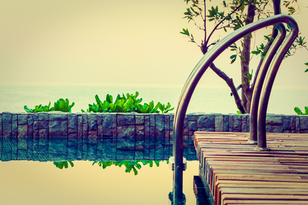 Beautiful luxury hotel swimming pool at twilight times - Vintage Filterの写真素材