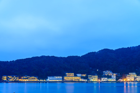 Lake Kawaguchiko and city at Twilight timesの写真素材