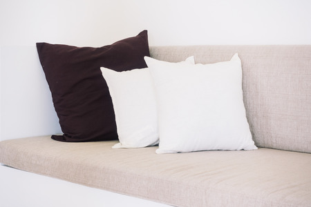Beautiful luxury pillow on sofa decoration in living room interior - Vintage light Filter