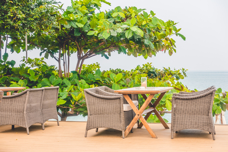 Empty chair and table with outdoor view - Light Vintage Filterの写真素材