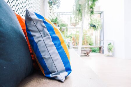 Patio outdoor deck with colorful pillow on chair decoration exterior of home - Vintage light filter