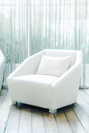 Beautiful luxury pillow on sofa decoration in living room interior - Vintage Light Filterの写真素材