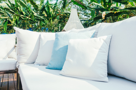 Beautiful luxury Pillow on sofa decoration in livingroom interior - Vintage Light Filterの写真素材