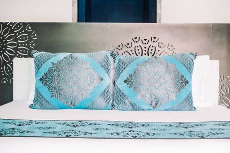 Beautiful luxury Pillow on bed decoration in bedroom interior - Vintage Light Filter