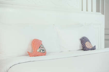 Beautiful luxury white pillow on bed decoration in bedroom interior - Vintage Light Filter