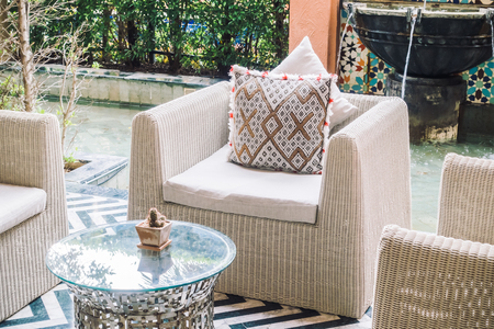 Beautiful luxury pillow on sofa decoration in living room interior - Vintage Light Filterの写真素材