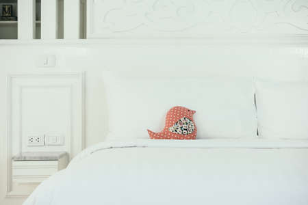 Beautiful luxury white pillow on bed decoration in bedroom interior - Vintage Light Filter
