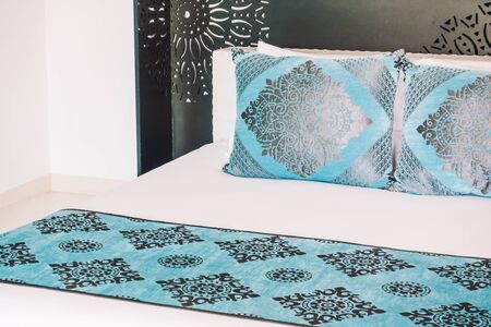 Beautiful luxury Pillow on bed decoration in bedroom interior - Vintage Light Filter
