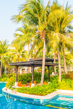 Empty Umbrella and chair around swimming pool in hotel resortのeditorial素材