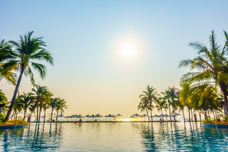 Empty Umbrella and chair around swimming pool in hotel resortのeditorial素材