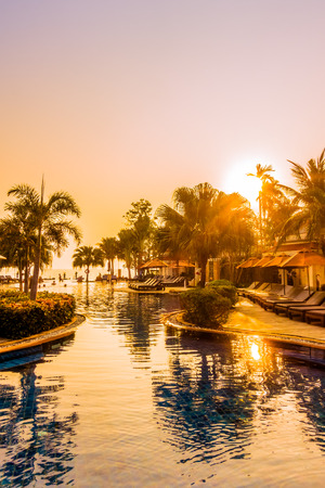 Beautiful luxury umbrella and chair around swimming pool in hotel resort at Sunset times - Vintage Filter and Boost up Color Processingのeditorial素材