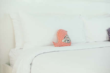 Beautiful luxury white pillow on bed decoration in bedroom interior - Vintage Light Filterの写真素材